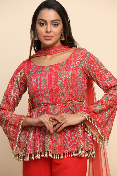 girl wearing a Beautiful Red Color Floral Motif Embroidered Sharara Set