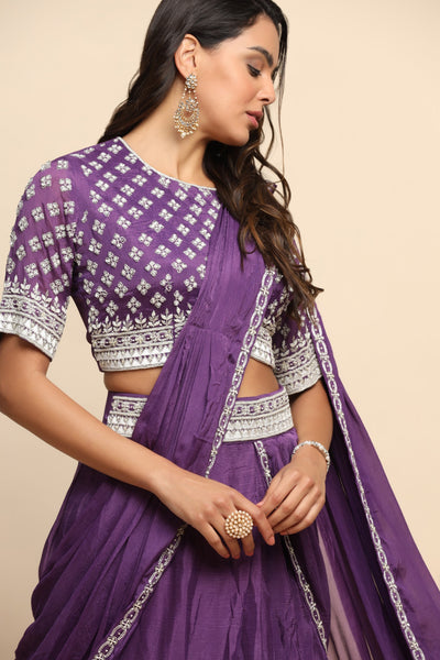 Elegant purple color floral motif embroidered skirt with draped saree