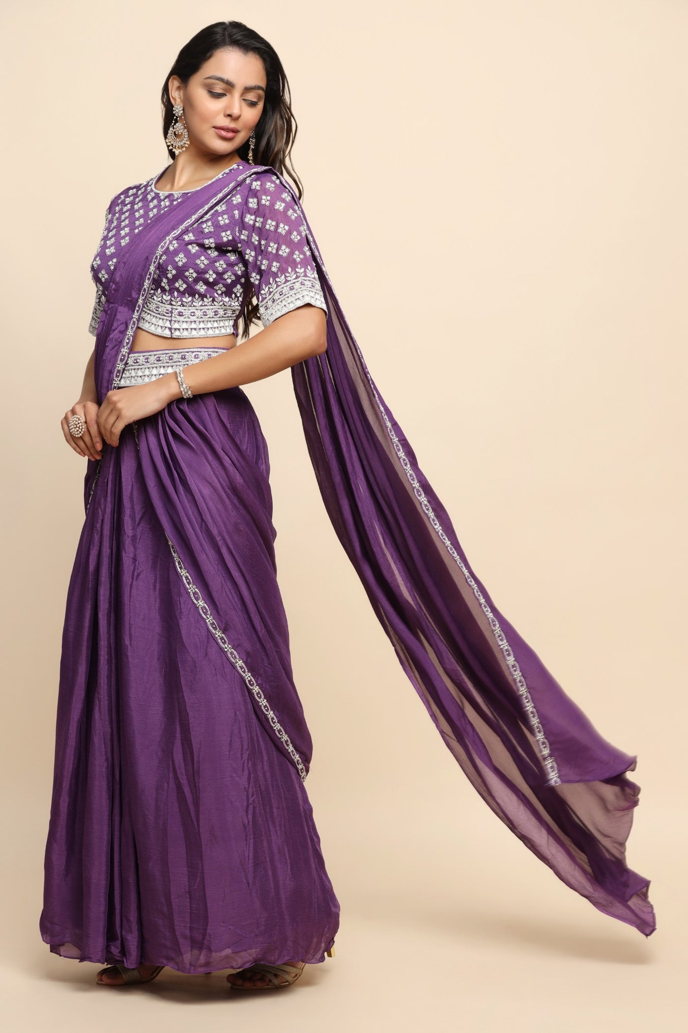 Elegant purple color floral motif embroidered skirt with draped saree
