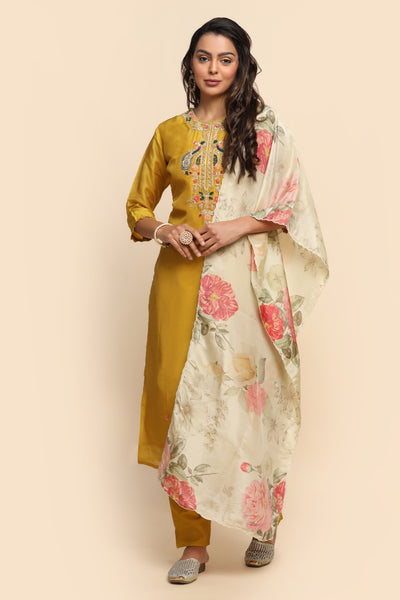 girl wearing a Beautiful Mustard Color Floral Embroidered Suit Set