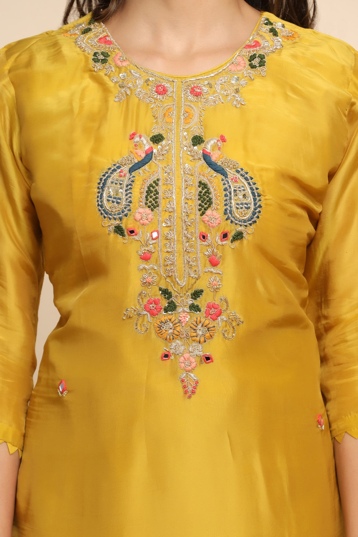 girl wearing a Beautiful Mustard Color Floral Embroidered Suit Set
