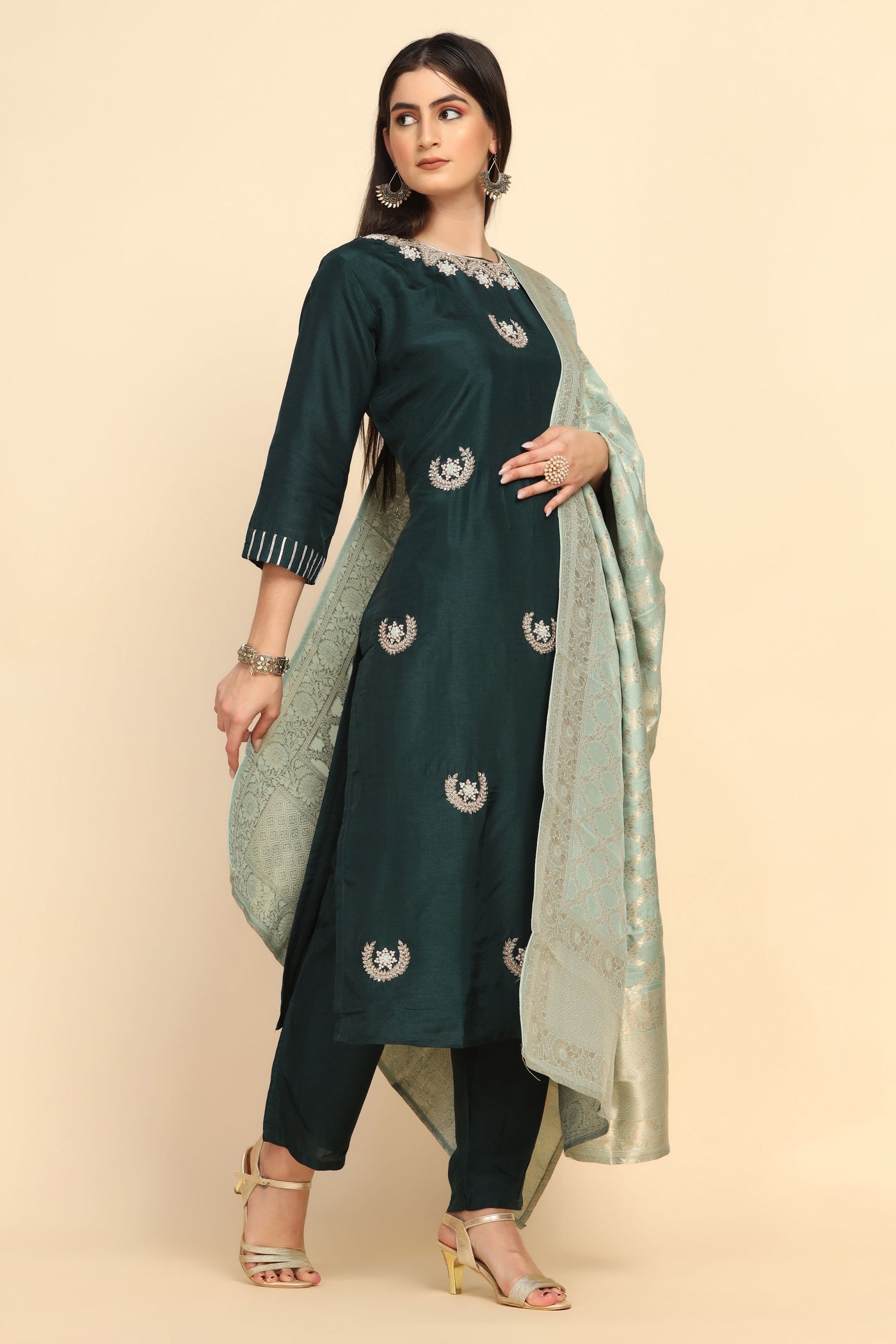 Girl Wearing a Bottle Green Floral Motif Embroidered Suit