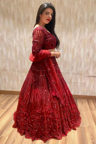 Deep red lehenga with floral embellishments and blouse