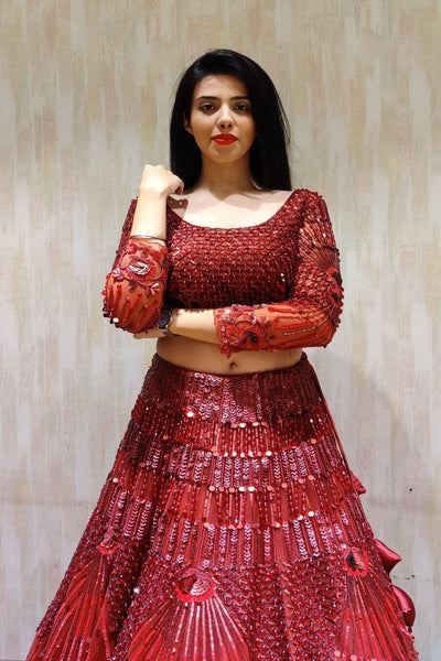 Deep red lehenga with floral embellishments and blouse