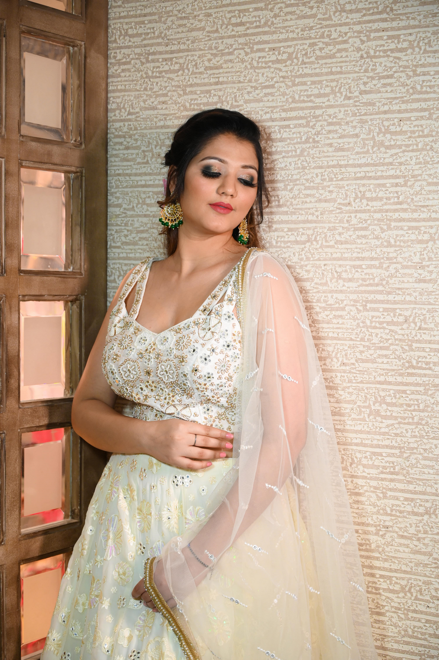 closer look of woman in white floral lehenga